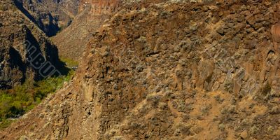 Basalt cliffs and talus from ancient lava flow Basalt cliffs and talus from ancient lava flow