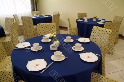 Blue Table, yellow chairs