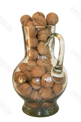Handful of walnuts in a glass decante Handful of walnuts in a glass decante