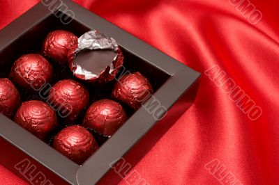 Chocolate Valentines truffles in red paper