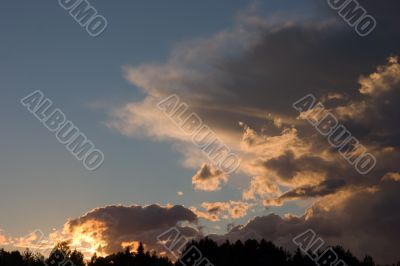 Sunset clouds over the forest