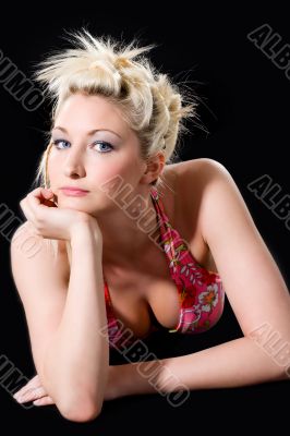 caucasian woman leaning on her hand look straight