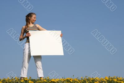 Nice girl holding blank white cardboard Nice girl holding blank white cardboard