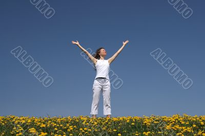 Young woman greets the sun Young woman greets the sun