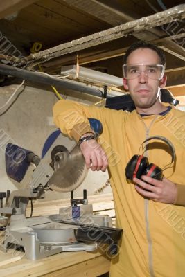 Young Man Holding His Ear Protection