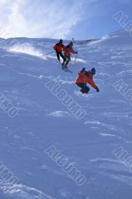 Multiple exposure: Red skier in powder snow