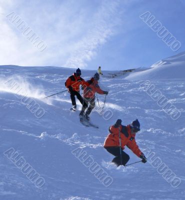 Multiple exposure: Red skier in powder snow