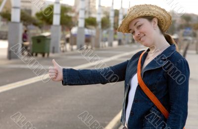 girl hitchhiking on the street girl hitchhiking on the street