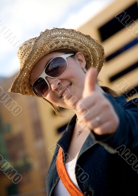female tourist with thumbs up