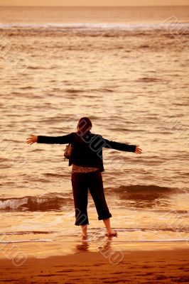 girl by the beach having fun