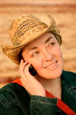 girl talking on a cellphone at sunset