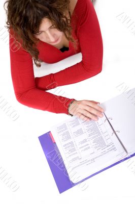 adult female studying on the floor