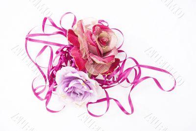two artificial roses, convoluted in purple tape