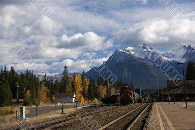 Freight train pulling out of station