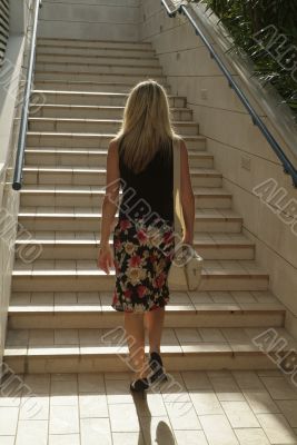 Blonde girl walking on stairs Blonde girl walking on stairs