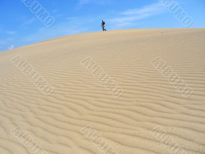 man on dunes. desert landscape