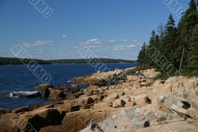 Breaking waves on granite ledges