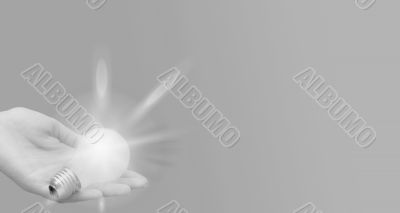 Background with lit lightbulb