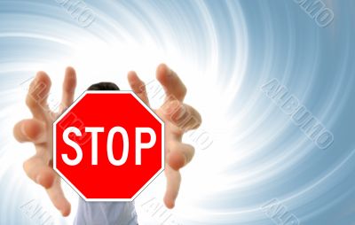 Man grabing a stop sign