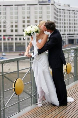 Newlywed couple kissing