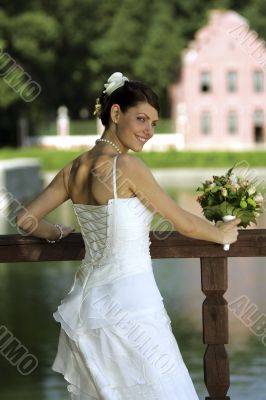 Smiling bride with bouquet