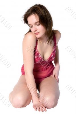 Woman in red lingerie kneeling