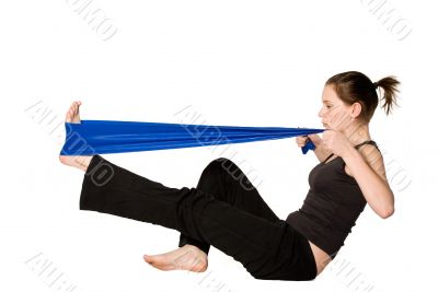 Woman is stretching her leg with a Resistance Band