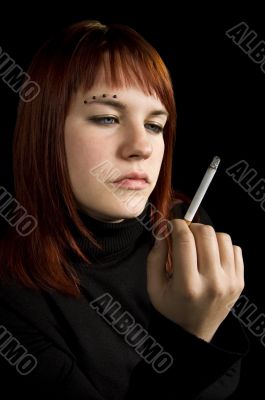 Girl watching her cigarette