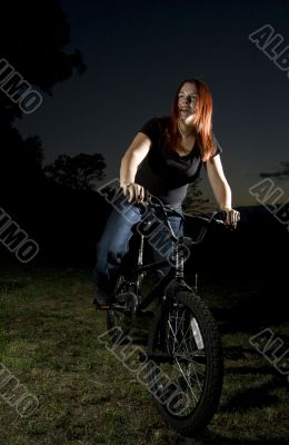 Girl riding a bmx bike Girl riding a bmx bike