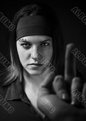 Girl ignoring a middle finger gesture and aggresively staring ba Girl ignoring a middle finger gesture and aggresively staring ba