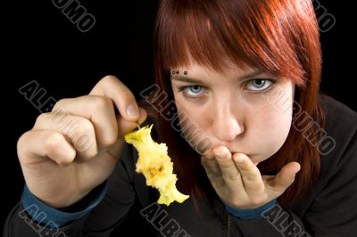 Girl full after eeating a delicious apple