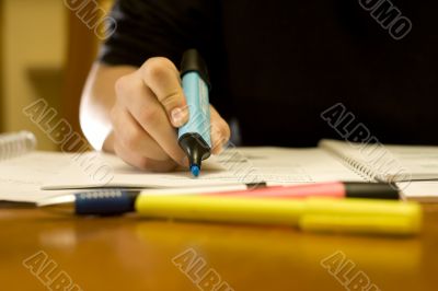 Close-up of a student using the marker pen