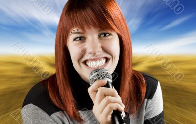 Joyful girl singing on the karaoke