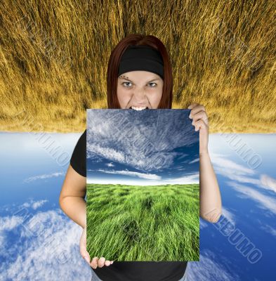 Angry girl holding a nature canvas