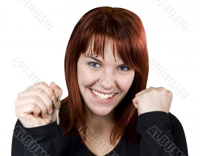Girl smiling holding keys and expressing her happiness