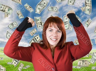 Girl rejoicing a win with dollars falling from the sky