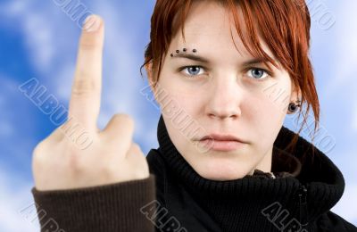 Angry girl showing middle finger