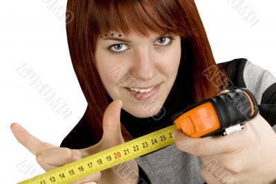 Redhead girl with measuring tool ruler