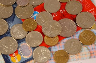 Silvery and yellow coins on credit cards