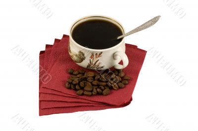 Isolated Cup of coffee on red paper with coffee-beans