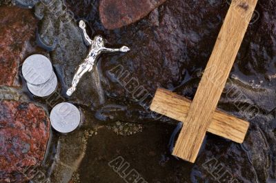 Cross, coins and Jesus figure.