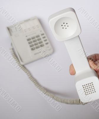 Hand with telephone receiver
