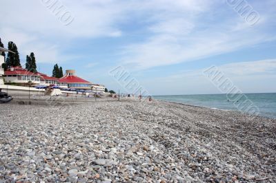 buildings on stony empty beach