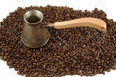 Cezve on coffee beans