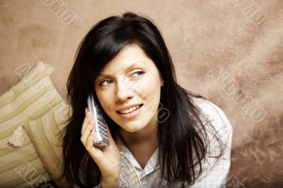 young woman is speaking on cell phone