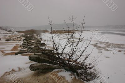 Winter lake and the broken railway.