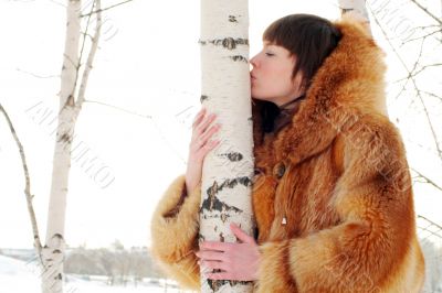 kissing birch trunk