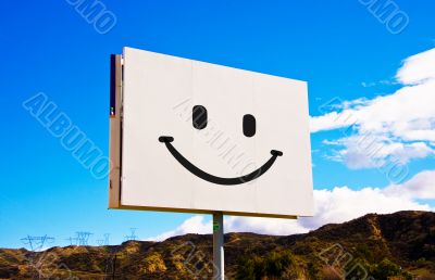 White Smiley roadside billboard
