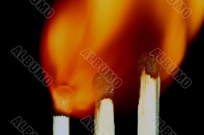 Match with smoke isolated in dark background