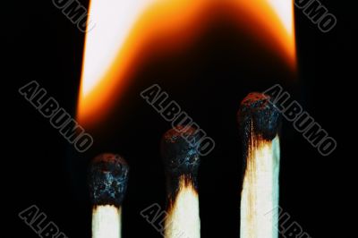 Match with smoke isolated in dark background